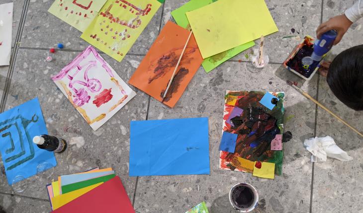 A child engages in art therapy after arriving from Afghanistan to the UK